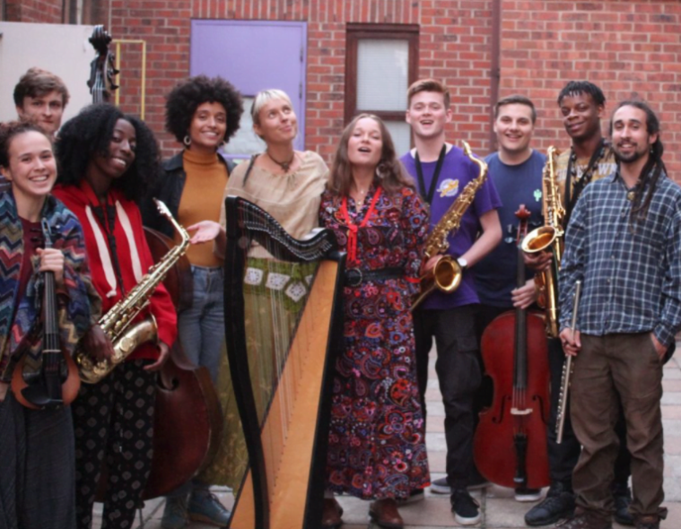 Levitation Orchestra take a rehearsal break in the MMC Courtyard